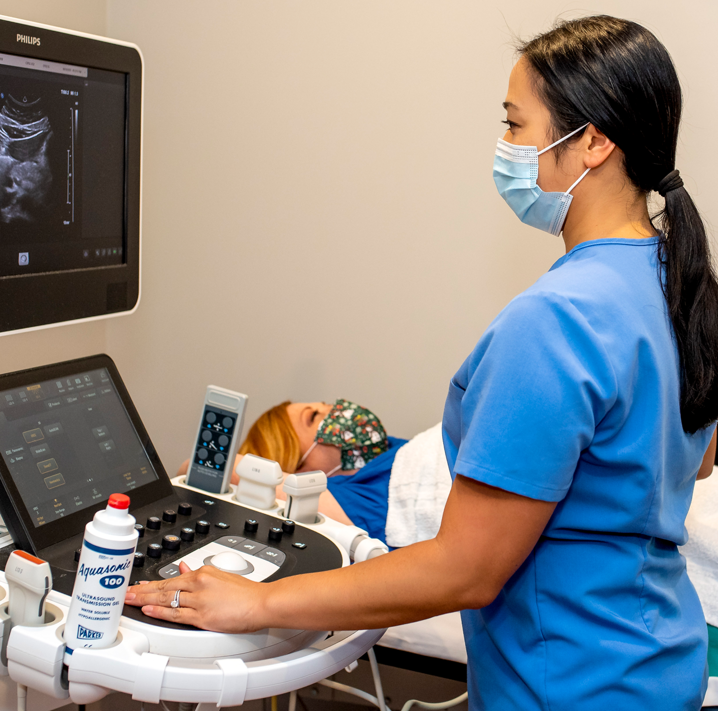 Ultrasound Tech performing Ultrasound on patient