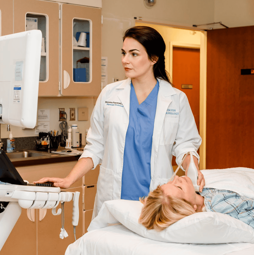 Certified Ultrasound technologist performing a thyroid test.