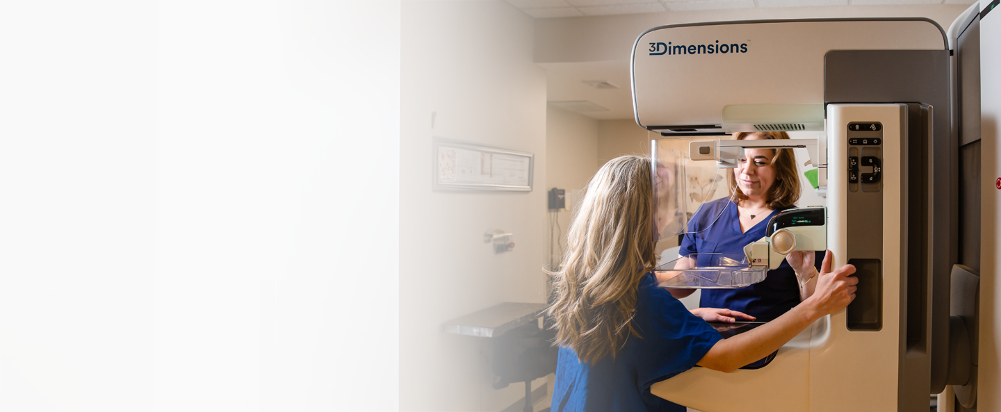 patient receiving mammogram by mammo tech